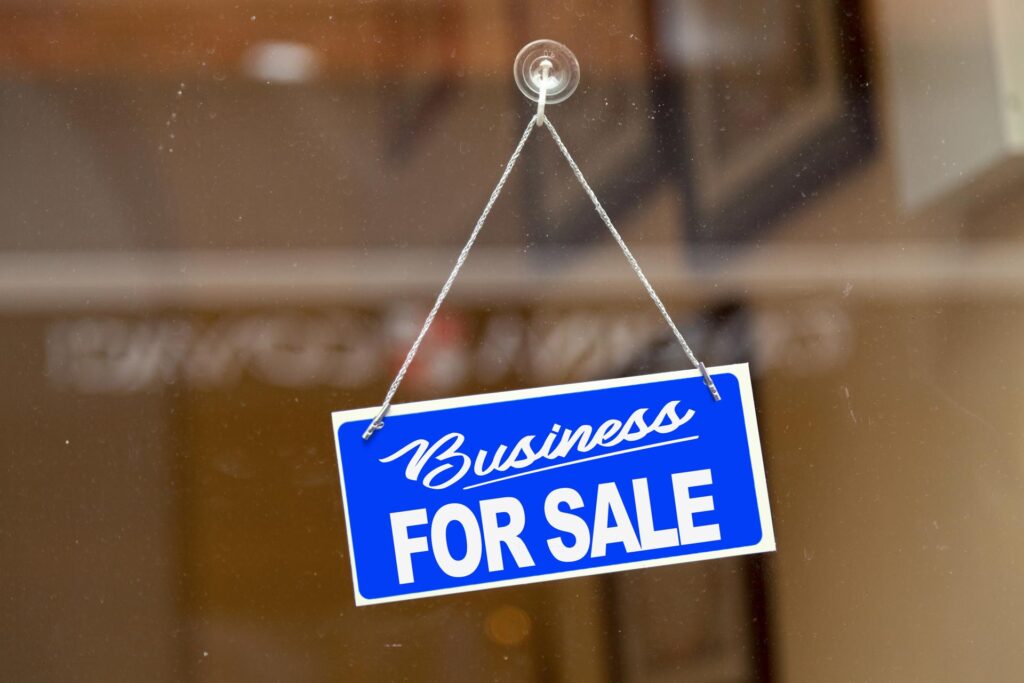 business for sale sign on shop window