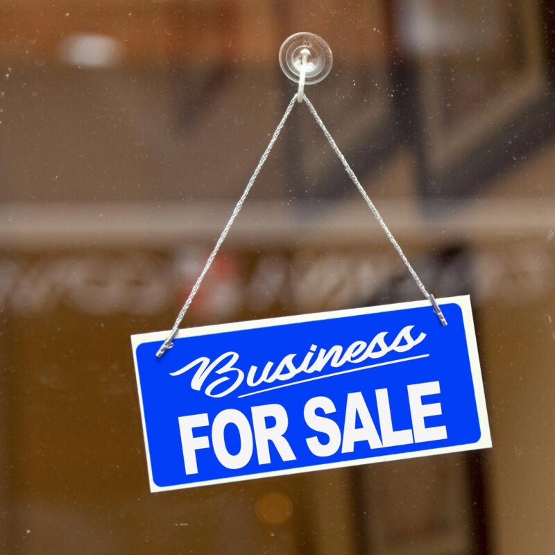 business for sale sign on shop window