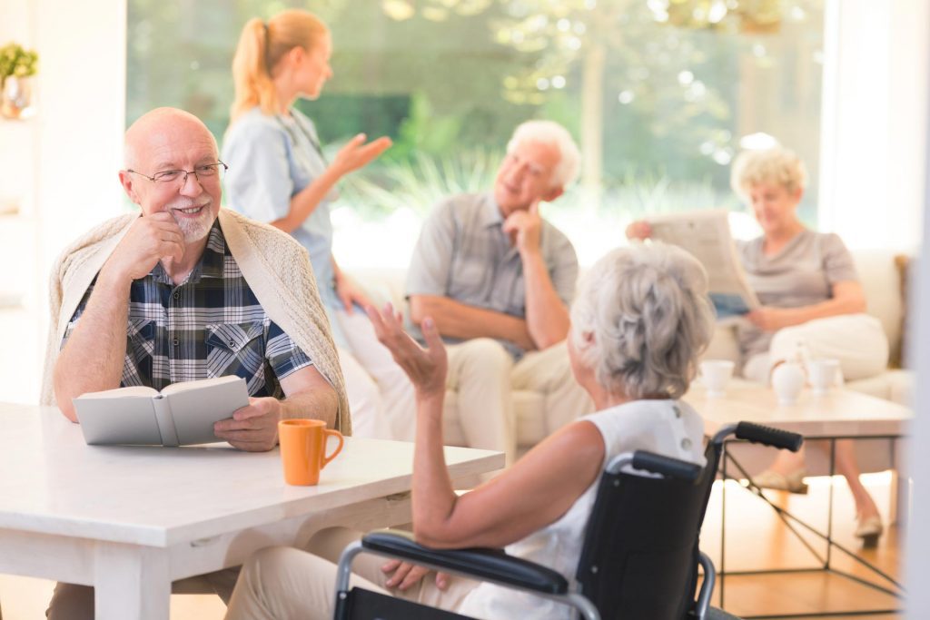 people chatting in retirement home